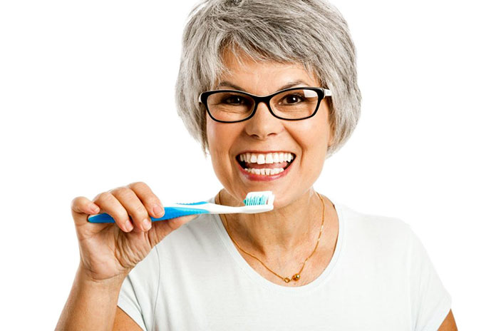 dental care and your health senior women toothbrush olympic dental & denture